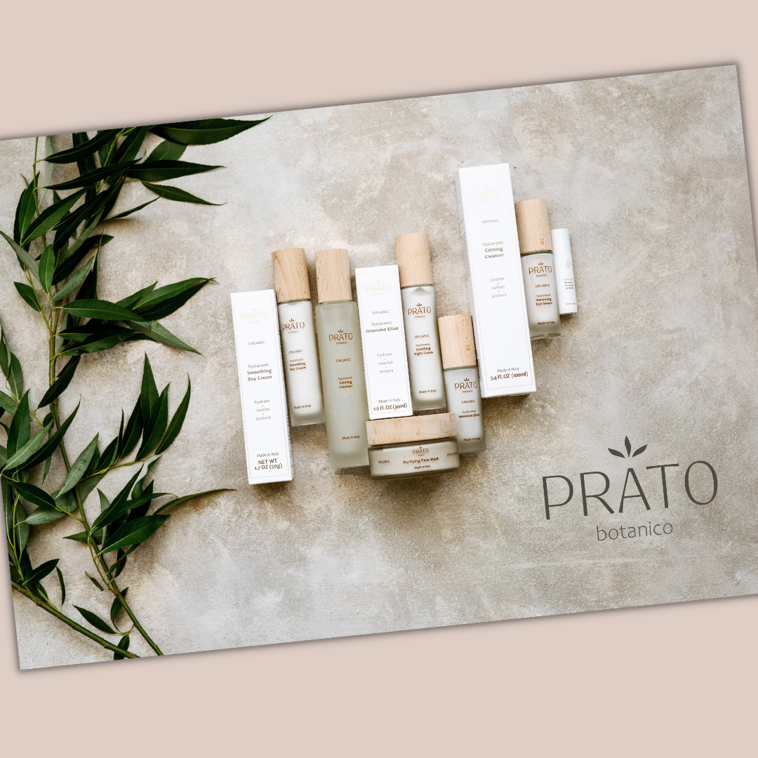 Prato Botanico Gift Card with full hyaluronic acid skincare line next to foliage