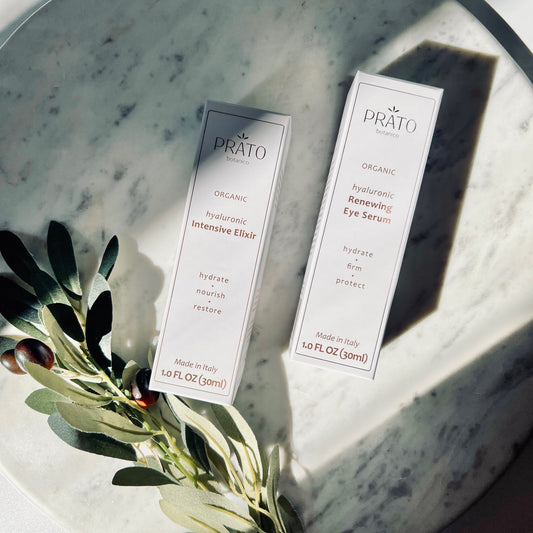 Organic Hyaluronic acid Prato Botanico Skin Illuminating Set on marble with olive leaf