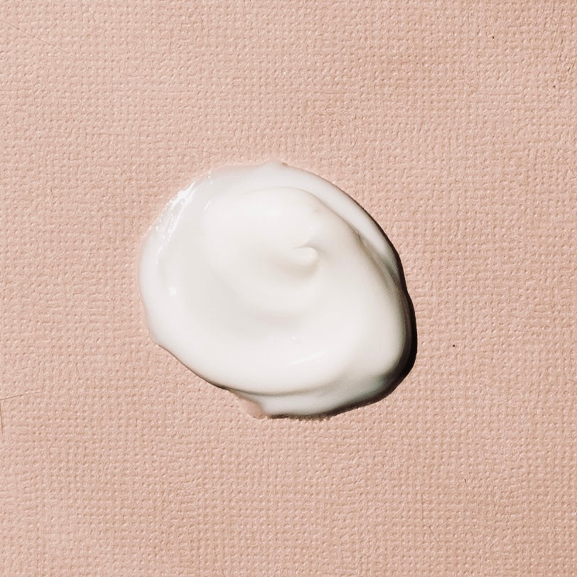 Organic Hyaluronic Acid Prato Botanico Smoothing Day Cream texture picture on pink background